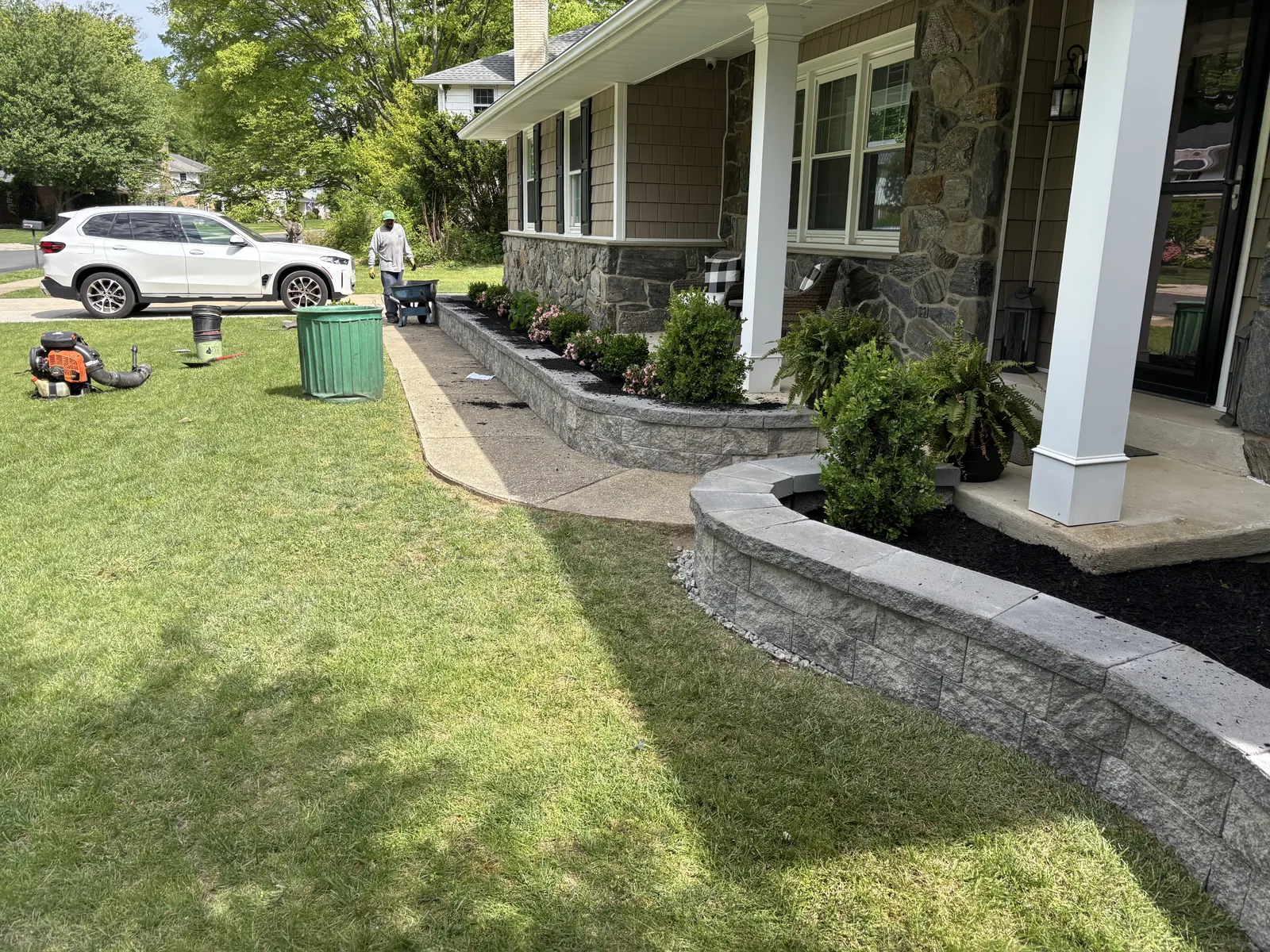 A natural-stone retaining wall and paver walkway in Delaware