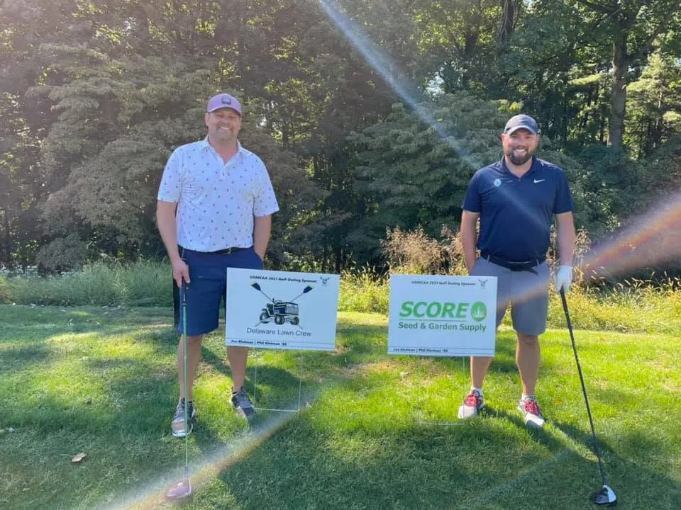Delaware Lawn Crew owners Joe and Phil Kleiman at a University of Delaware golf outing the company sponsored